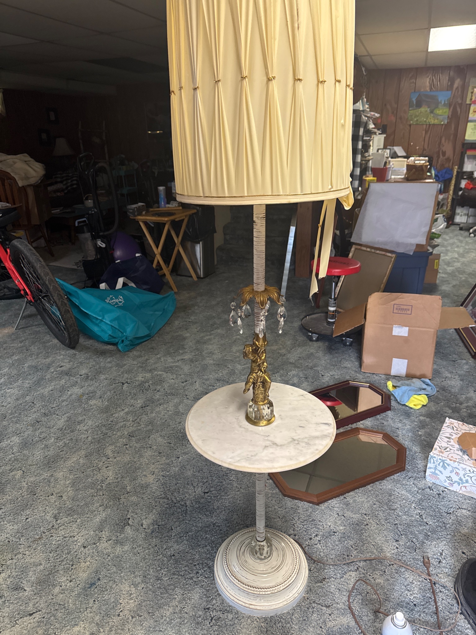Decorative floor lamp with marble table shelf and cherub/crystal accents
