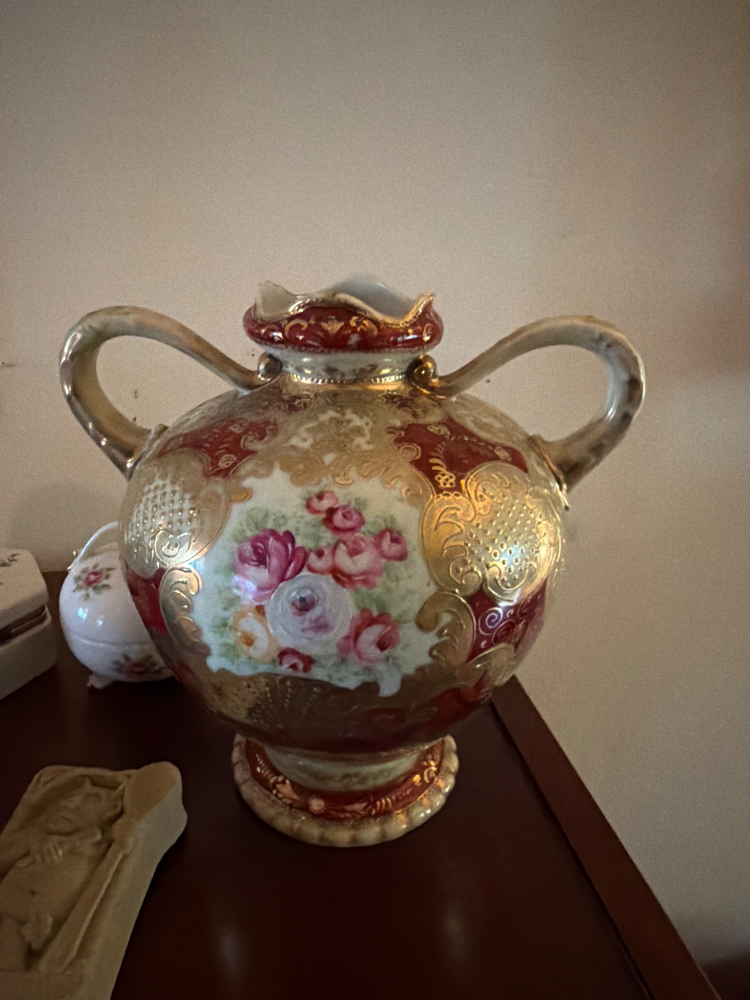 Decorative hand-painted porcelain vase with twin handles