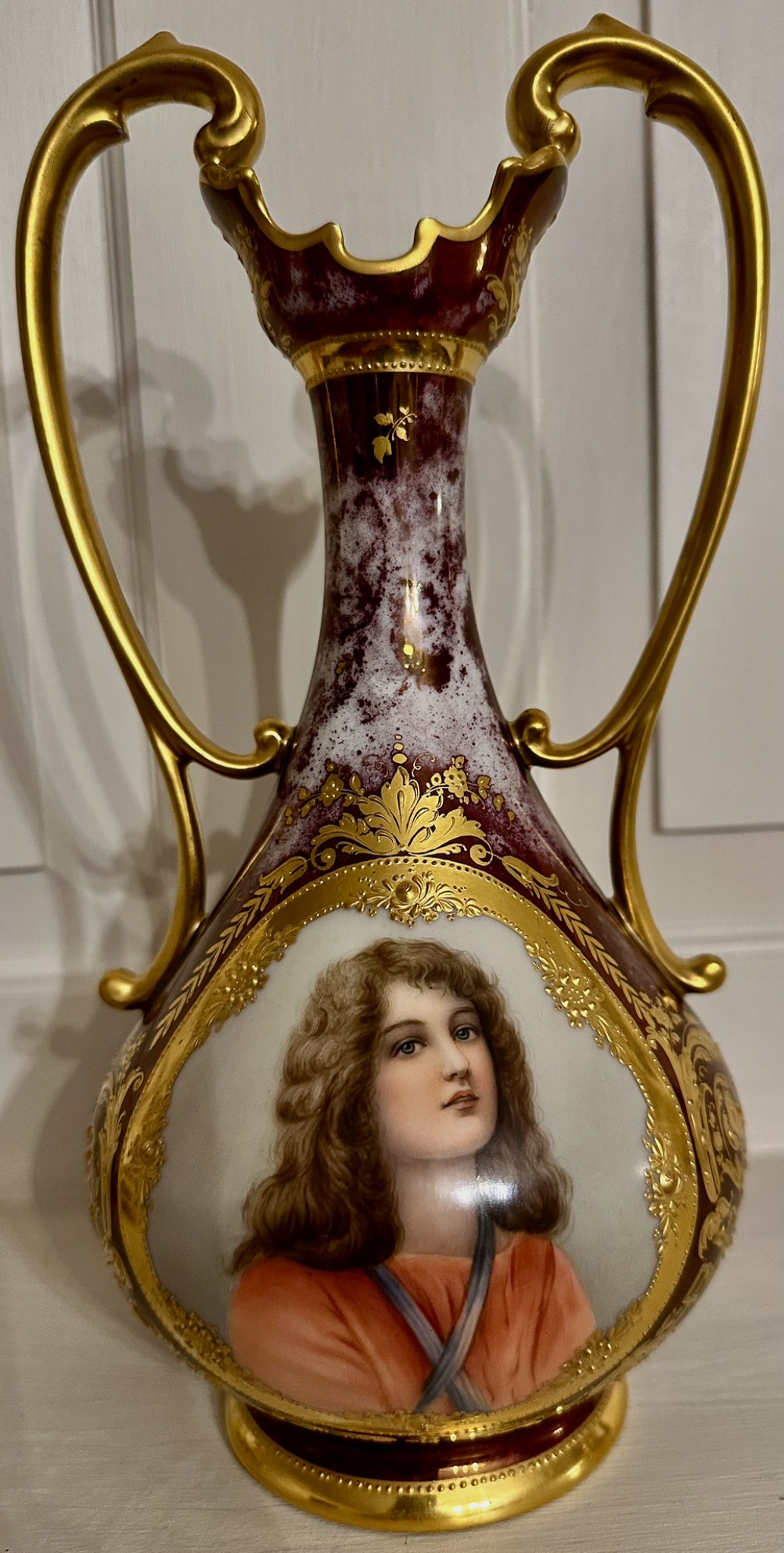 Decorative porcelain double-handled vase with portrait decoration