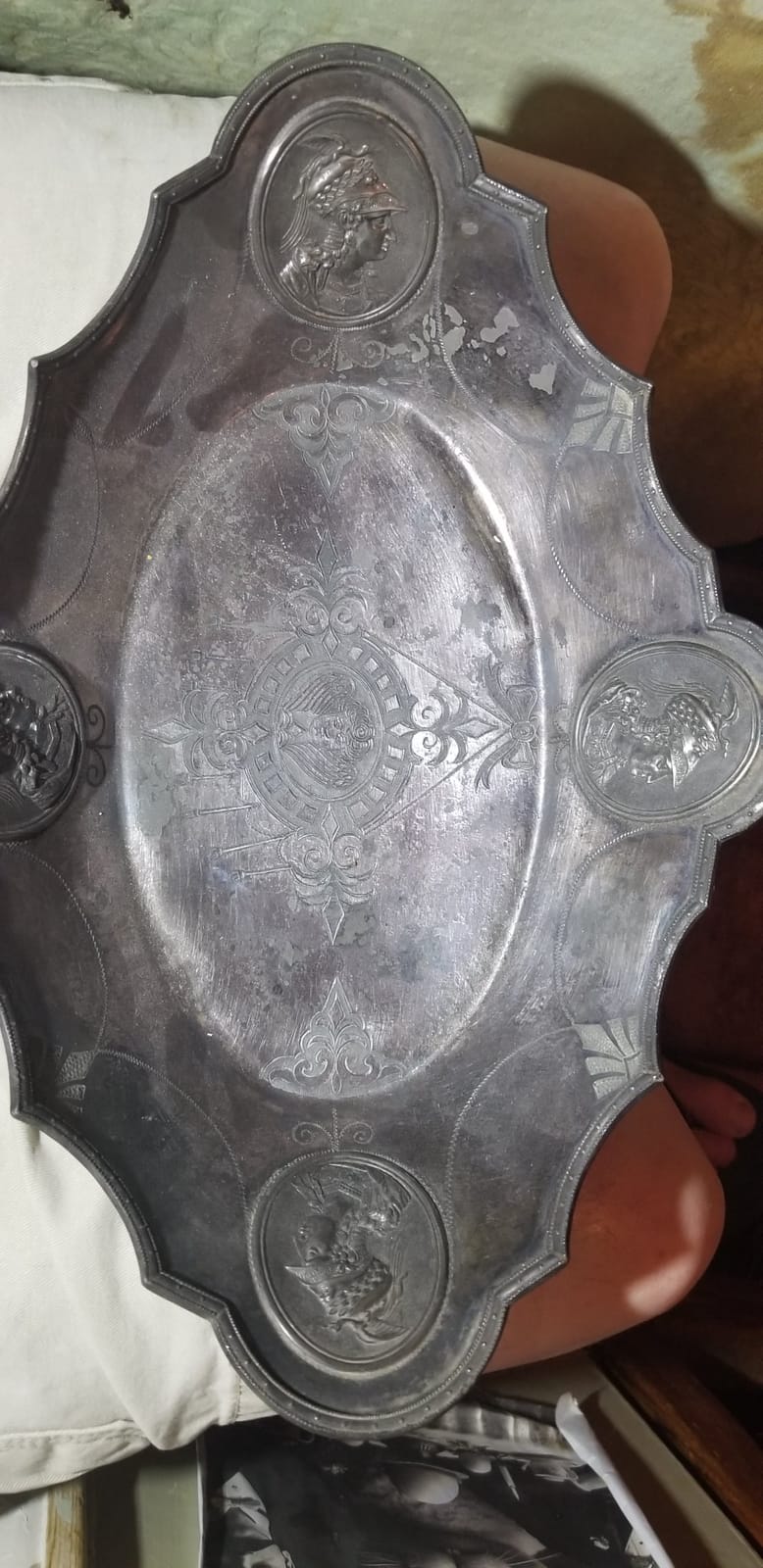 Decorative silver-plated serving tray with classical medallion portraits