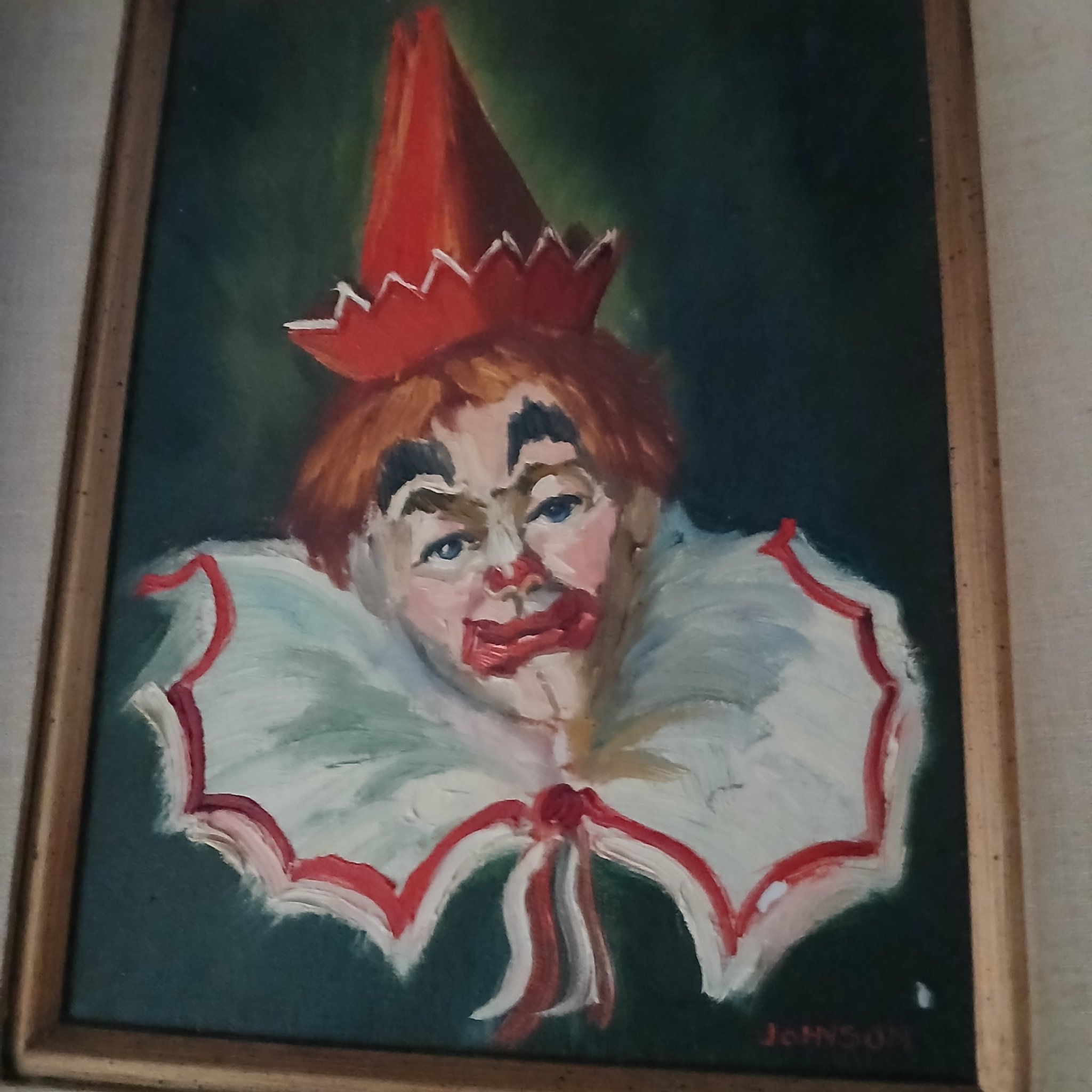 Framed clown portrait painting