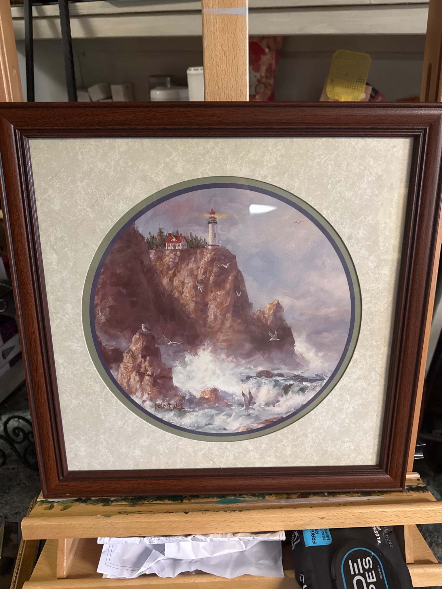 Framed coastal lighthouse print or painting