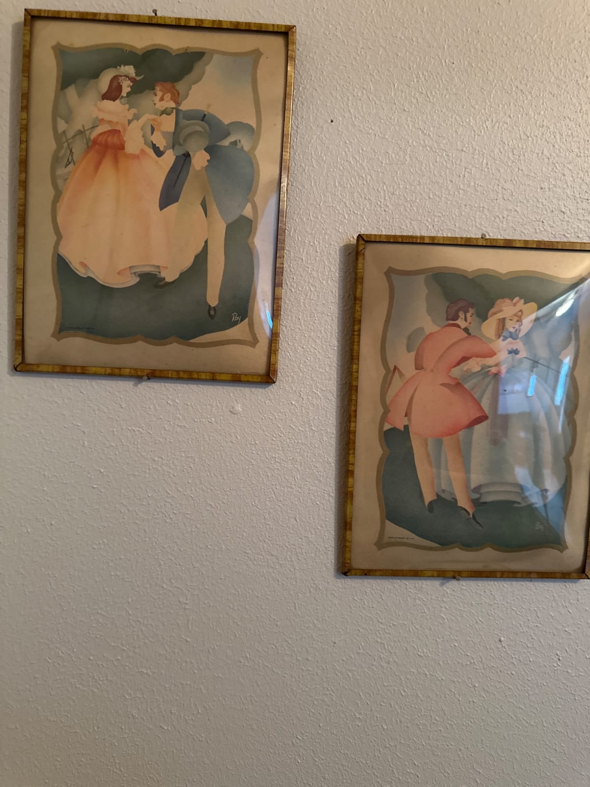 Framed fashion illustration prints (likely early 20th-century decorative art prints)