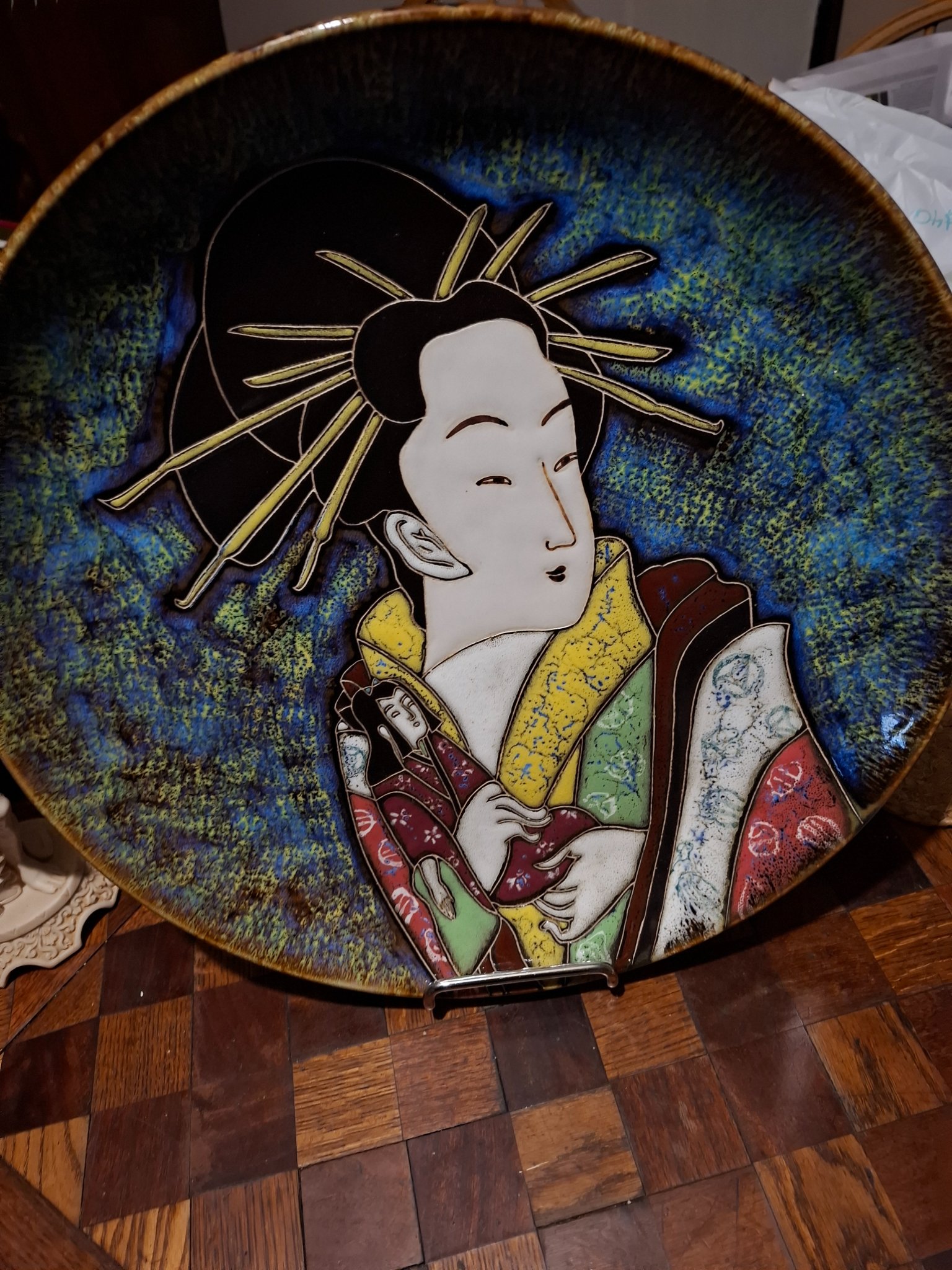 Japanese-style decorative ceramic plate with geisha motif