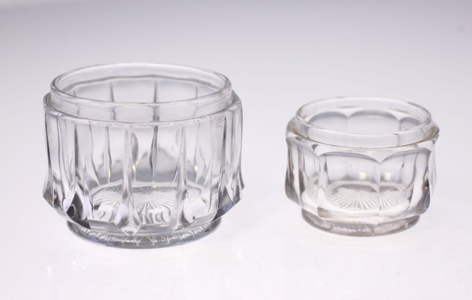 Pair of clear pressed-glass open salt cellars / small condiment dishes