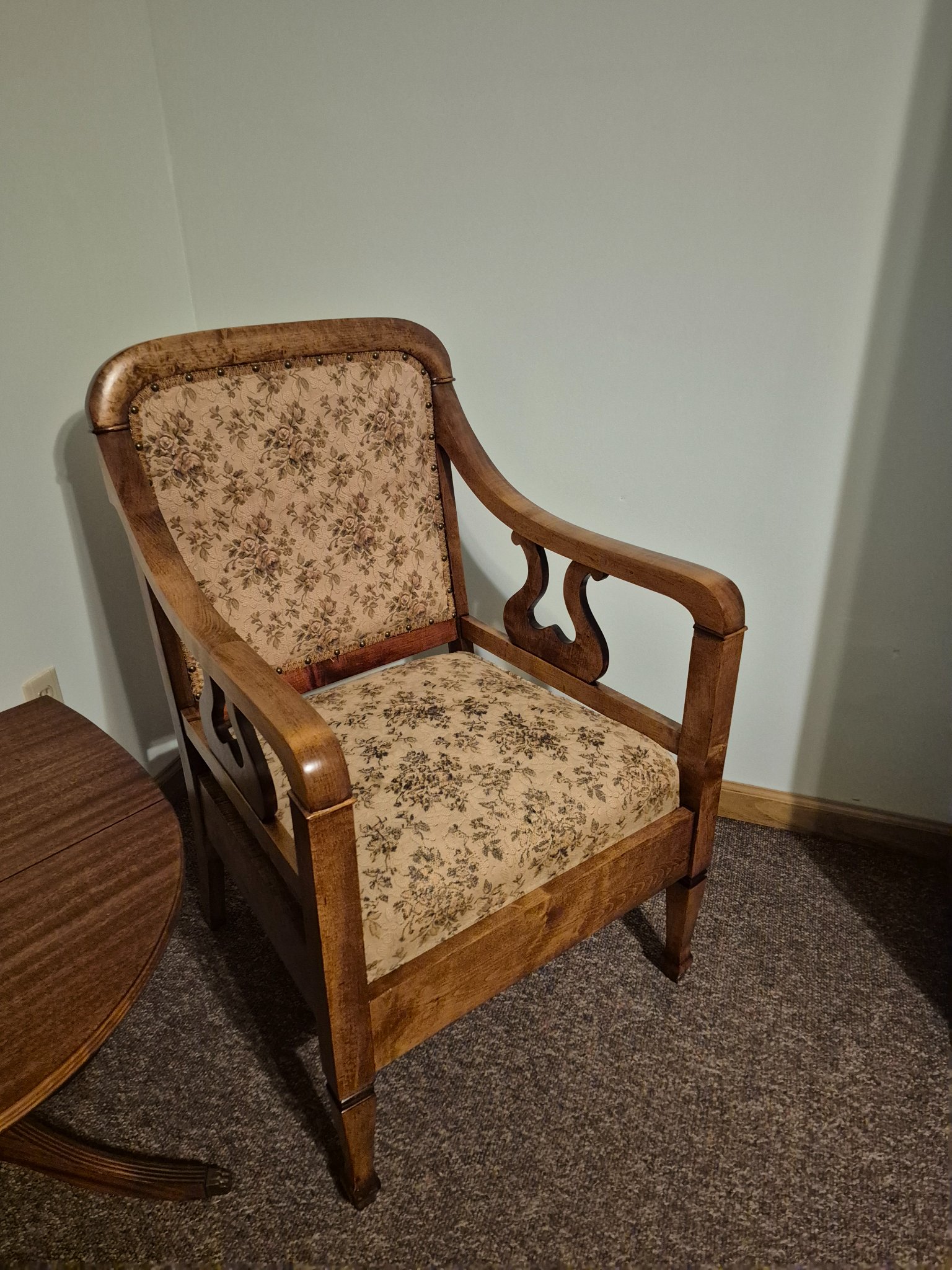 Upholstered wooden armchair