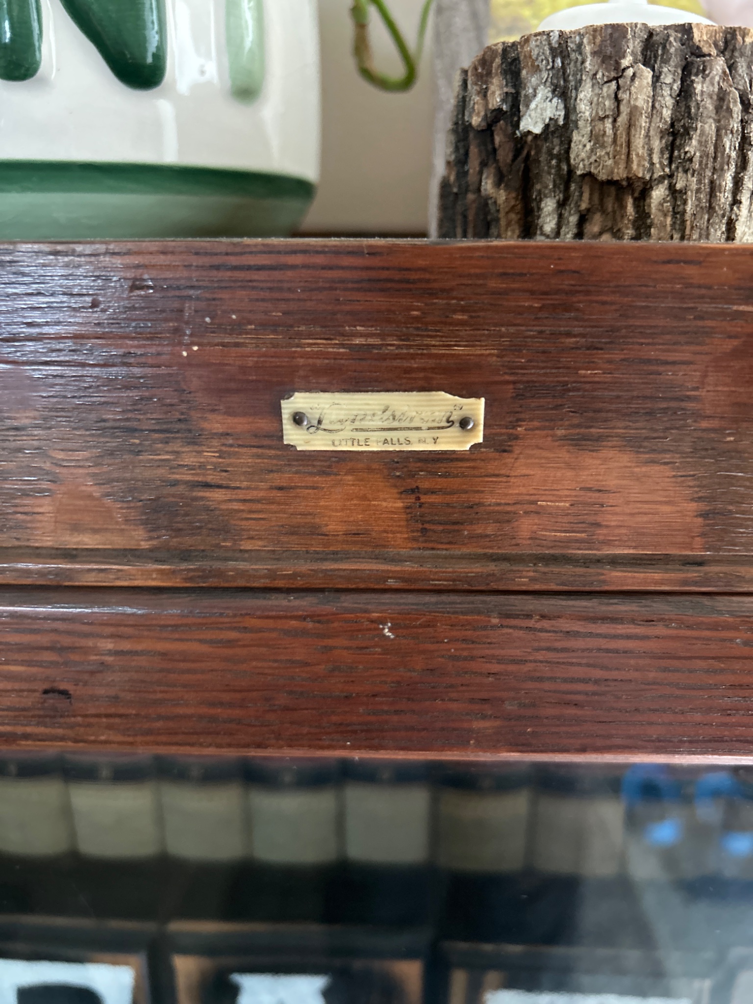 Wooden display cabinet or shelf with maker's label